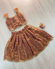 Designer Girls Metallic Rust Silk Lehenga Choli with Bow Accent & Pearl Lace Details